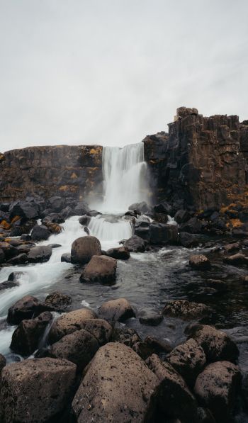 Iceland, waterfall, stones Wallpaper 600x1024