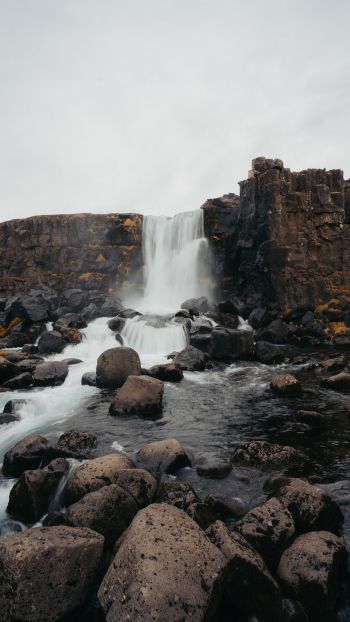 Iceland, waterfall, stones Wallpaper 1440x2560
