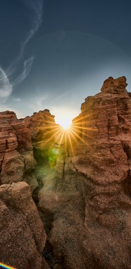 sunlight, rocks, landscape Wallpaper 1080x2220