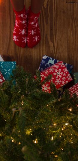 gifts, Christmas tree, holidays, feet, socks, bright light bulbs Wallpaper 1440x2960