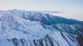snow in the mountains, mountains, winter, drone view Wallpaper 1366x768