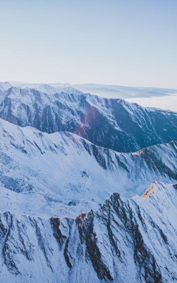 Обои 800x1280 снег в горах, горы, зима, вид с дрона