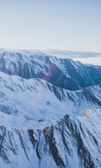Обои 1200x2000 снег в горах, горы, зима, вид с дрона