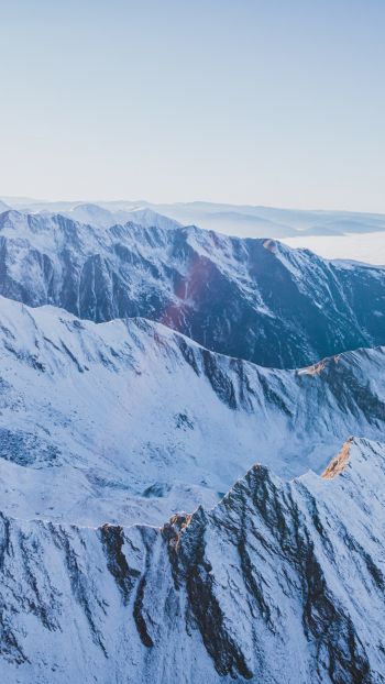 Обои 2160x3840 снег в горах, горы, зима, вид с дрона