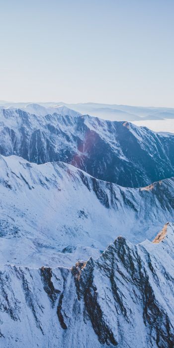 snow in the mountains, mountains, winter, drone view Wallpaper 720x1440