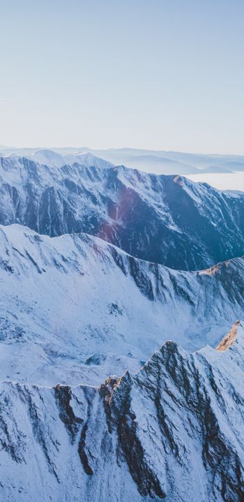 snow in the mountains, mountains, winter, drone view Wallpaper 1440x2960
