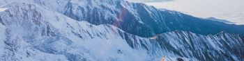snow in the mountains, mountains, winter, drone view Wallpaper 1590x400