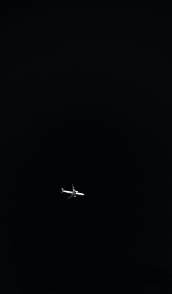 Обои 600x1024 самолет, ночь, черный фон