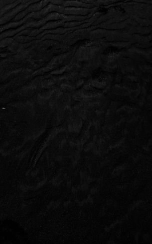 Обои 800x1280 черный песок, частицы, ночь