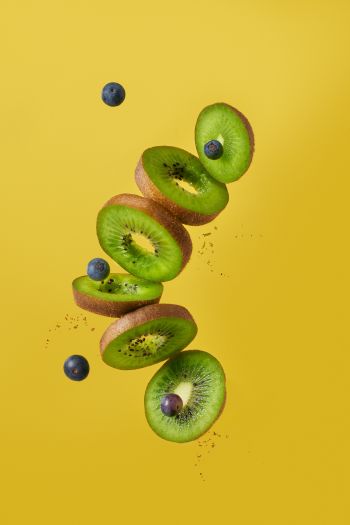 kiwi, blueberry, yellow background Wallpaper 640x960