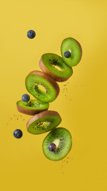 kiwi, blueberry, yellow background Wallpaper 640x1136