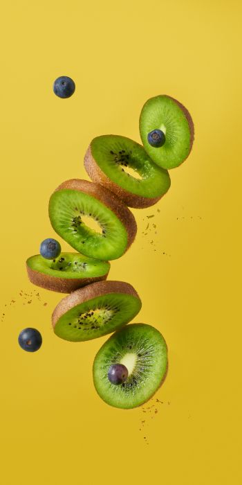 kiwi, blueberry, yellow background Wallpaper 720x1440