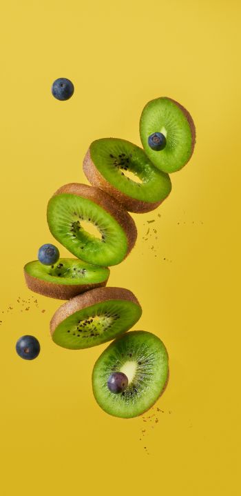 kiwi, blueberry, yellow background Wallpaper 1440x2960