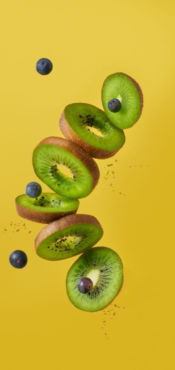 kiwi, blueberry, yellow background Wallpaper 1080x2280