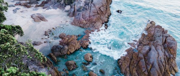 ocean, rocks, sand Wallpaper 2560x1080