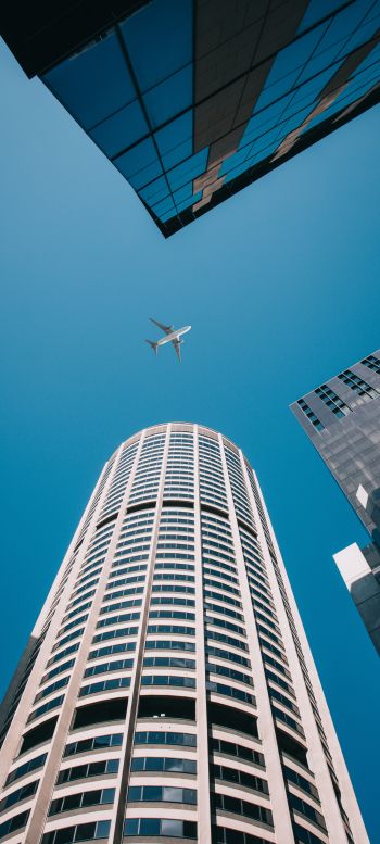 plane, buildings, height Wallpaper 720x1600