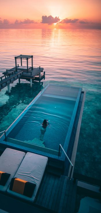 Maldives, sunset, swimming pool Wallpaper 1440x3040