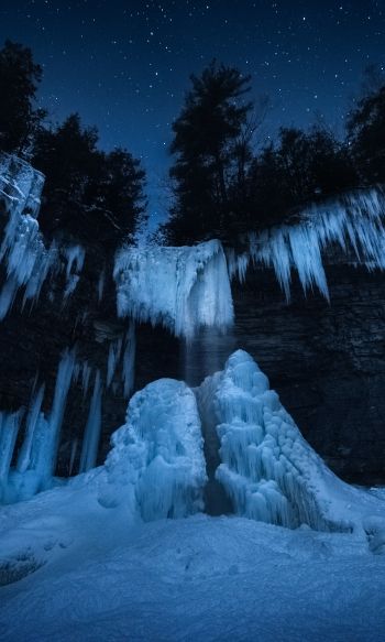 Обои 1200x2000 замерзший водопад, ночной лес, зима