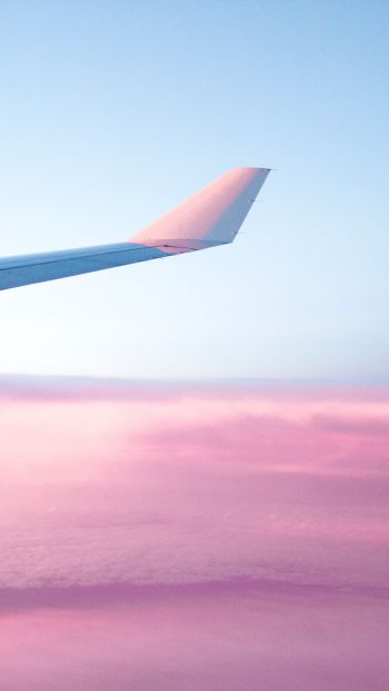 Обои 640x1136 крыло самолета, розовое небо, полет