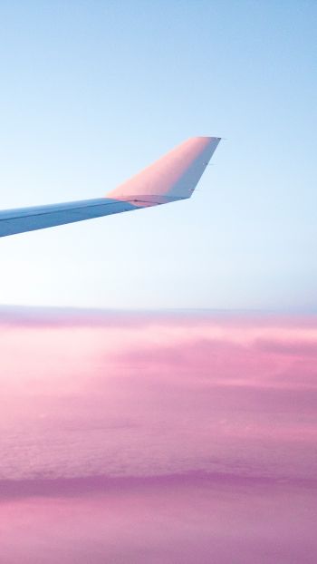 Обои 720x1280 крыло самолета, розовое небо, полет