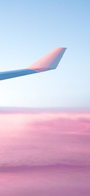 Обои 828x1792 крыло самолета, розовое небо, полет