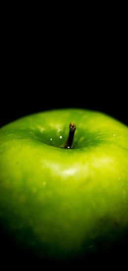green apple, on black background, macro Wallpaper 1080x2280