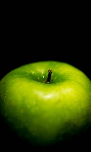 green apple, on black background, macro Wallpaper 1200x2000