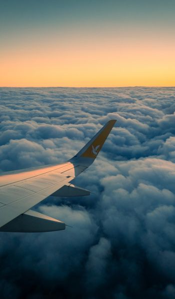 Ramadan, airplane wing, above the clouds Wallpaper 600x1024