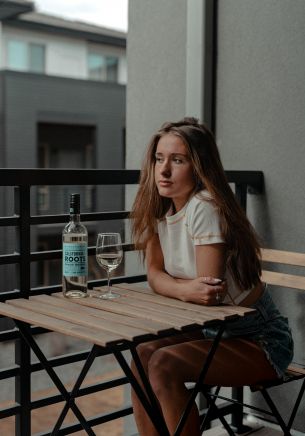 girl, balcony, bottle of wine Wallpaper 1668x2388