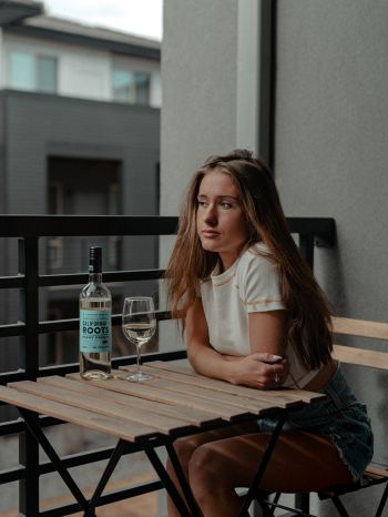 girl, balcony, bottle of wine Wallpaper 1668x2224