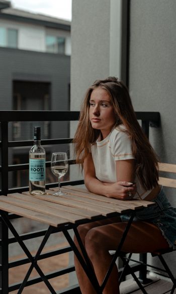 girl, balcony, bottle of wine Wallpaper 1200x2000