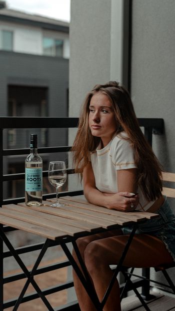 girl, balcony, bottle of wine Wallpaper 640x1136