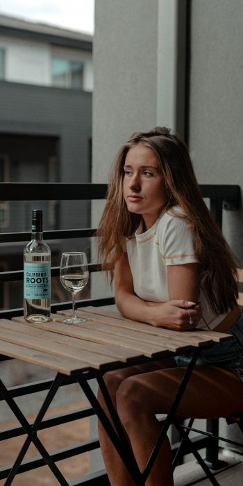 girl, balcony, bottle of wine Wallpaper 720x1440