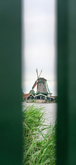 Zaanse Shans, Zandam, The Netherlands, windmill in the distance Wallpaper 1170x2532