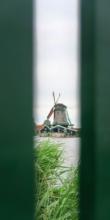Zaanse Shans, Zandam, The Netherlands, windmill in the distance Wallpaper 720x1440