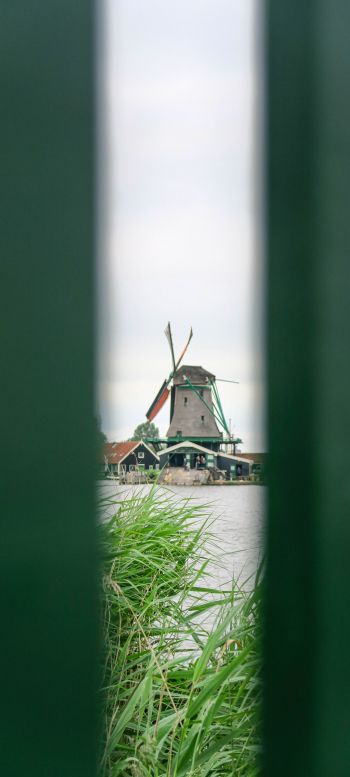 Zaanse Shans, Zandam, The Netherlands, windmill in the distance Wallpaper 720x1600