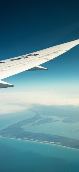 airplane wing, above ground Wallpaper 1080x2340