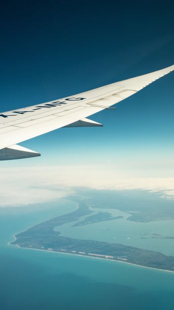 airplane wing, above ground Wallpaper 750x1334