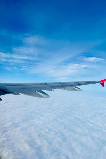 Обои 640x960 крыло самолета, над облаками
