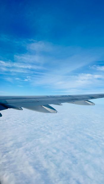 Обои 640x1136 крыло самолета, над облаками
