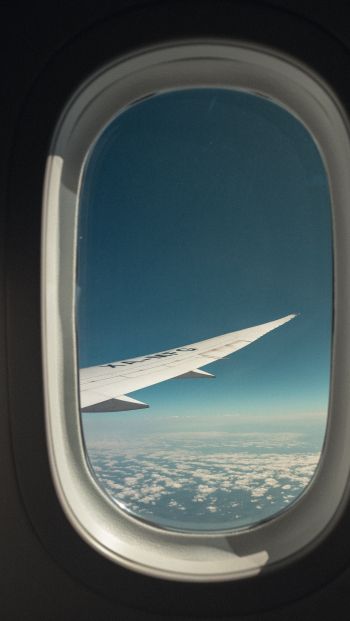 airplane wing, window view Wallpaper 640x1136