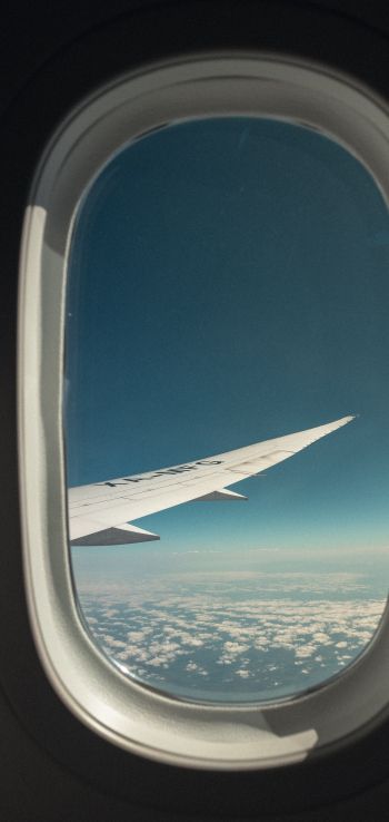airplane wing, window view Wallpaper 1080x2280