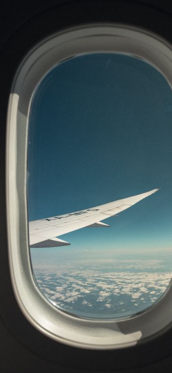 airplane wing, window view Wallpaper 1242x2688