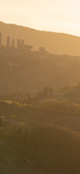 province of Siena, Italy, over the city Wallpaper 1170x2532