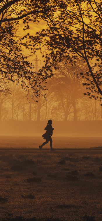 in yellow haze, running man Wallpaper 828x1792