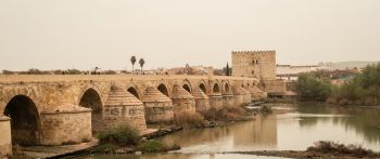 Roman bridge, Cordoba, Spain Wallpaper 2560x1080