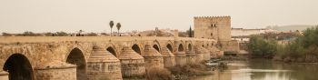 Roman bridge, Cordoba, Spain Wallpaper 1590x400