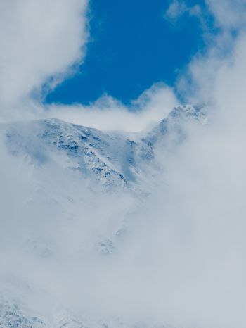 Обои 1620x2160 горы, снег, облака