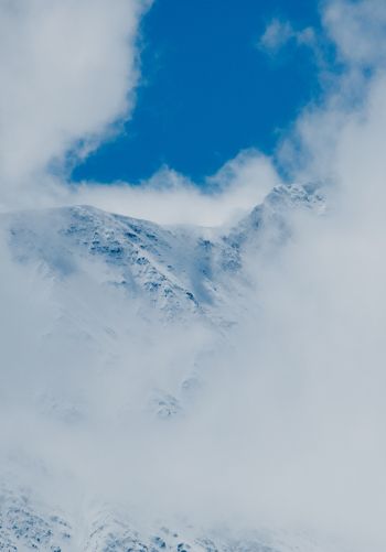 Обои 1668x2388 горы, снег, облака