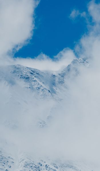 Обои 600x1024 горы, снег, облака